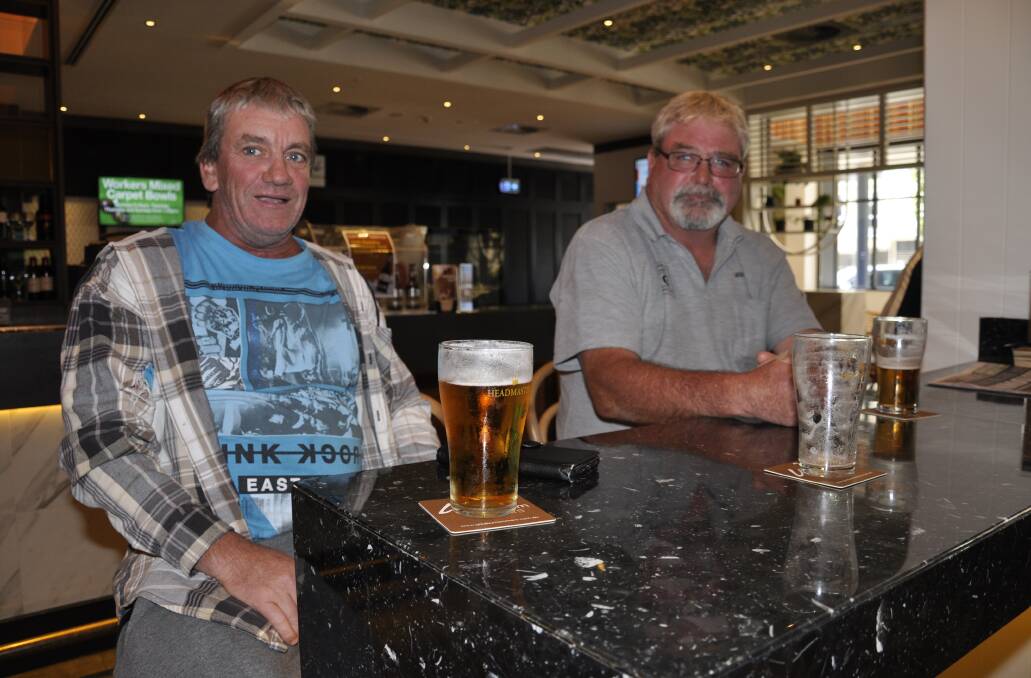Goulburn men Shaun Hart and Gary Scott enjoyed a final drink before the Workers Club closed on Monday. Photo: Louise Thrower.