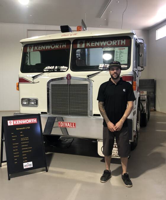 ON THE ROAD: Riley Topping, pictured here with a Divall's truck at the Kenworth Hall of Fame in Alice Springs, is taking part in a leaders' forum. Photo supplied.