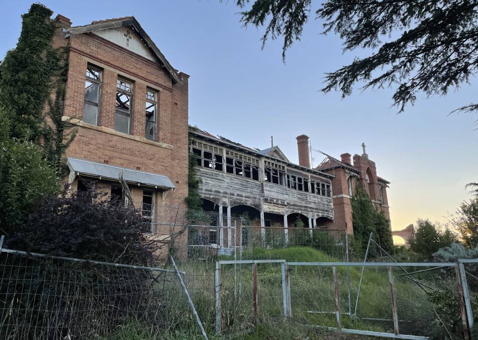 The bulk of the fire-damaged Saint John's orphanage is still standing, despite the demolition order. Photo: Louise Thrower.