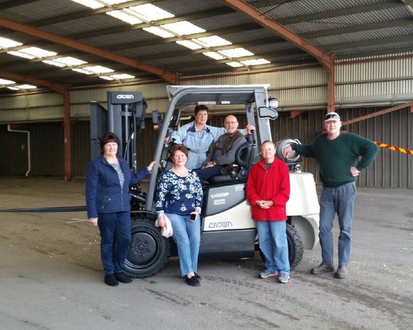 Goulburn AP&H Society secretaries Robyn Picker and Trish McLaughlin, president Jacki Waugh, treasurer Nestor Ellinopoullos, systems manager Heather Pearsall maintenance supervisor, Anthony O'Brien with the new forklift. Photo supplied.