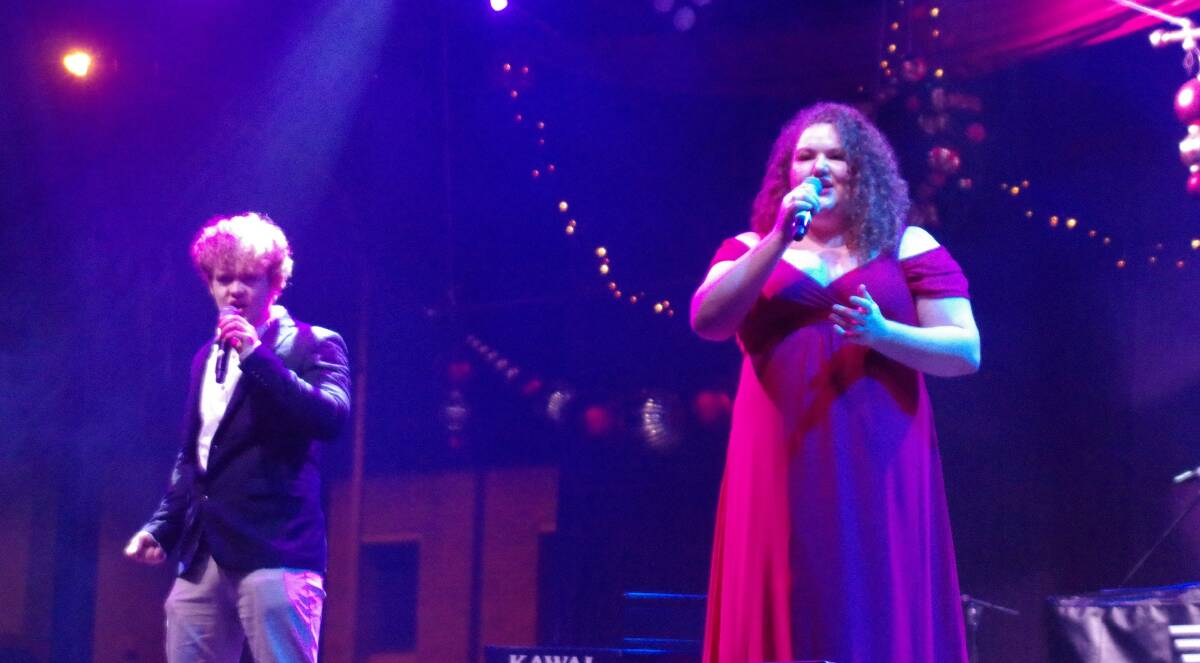 Local singer Nathanael Patterson and Madeline Anderson from Braidwood performing at last year's Carols of Hope. 