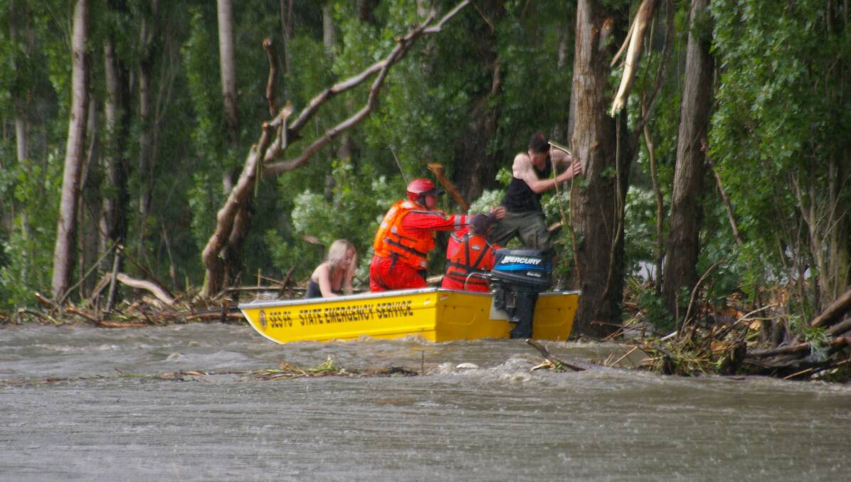 Goulburn SES performed six rescues during drought-breaking rain in December 2010. Two teenagers were plucked from a raging Wollondilly River near Tully Park golf course. Picture by Darryl Fernance.