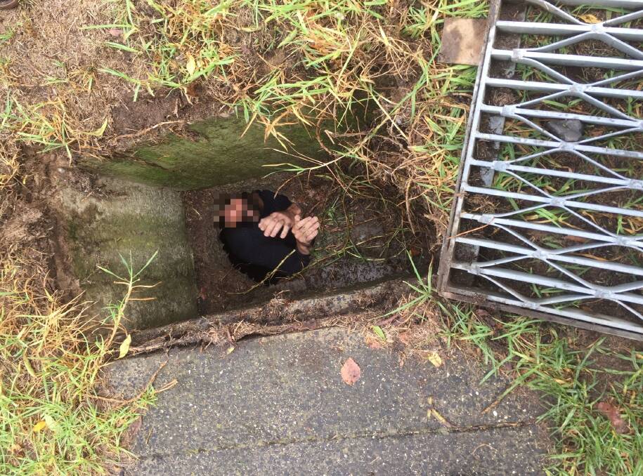 Police Rescue cut around a manhole to free a man who was stuck in a drain overnight in Goulburn.