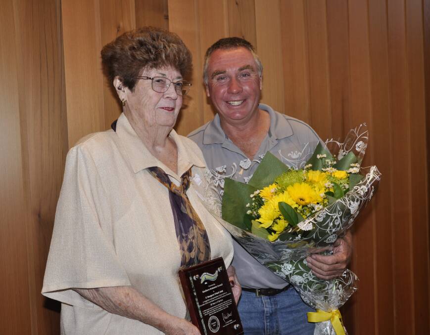 Cr Andrew Banfield made a special presentation to Margaret O'Neill, his "second mother," recognising her 38 years' council service. Photo: Louise Thrower.