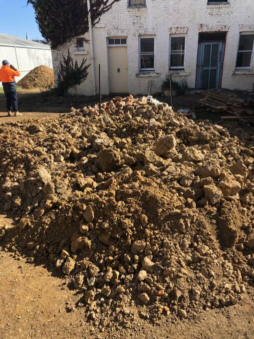 Large piles of dirt were dug from underneath Saint Clair to lift the floor and address dampness. Photo: Sarah Ruberto.
