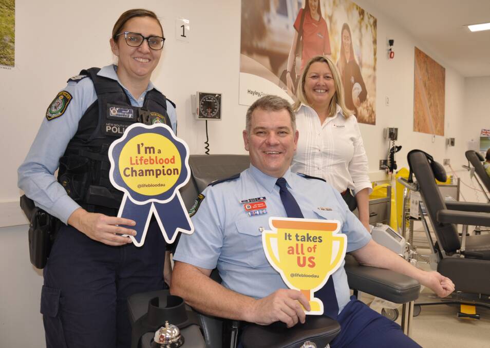 SHOT IN ARM: NSW Police Academy chief inspector Nick Hallett is ready for the Emergency Services Blood Challenge along with First Nations student support liaison officer Sergeant Bianca Williams. Lifeblood Goulburn group accounts manager, Megan Green watches on. Photo: Louise Thrower.