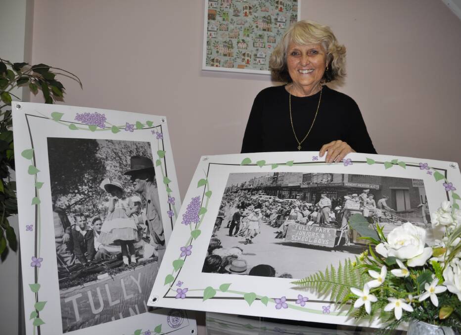 Carol James has been awarded an OAM in the general division for her service to the community. She is holding photos of herself with her father, Harry Gillette, at an early 1950s Lilac Festival procession. Picture by Louise Thrower.