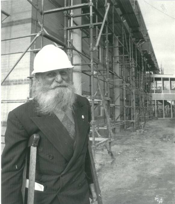 Archie Hancock served as a Goulburn City councillor in the 1980s. He was a well known junk collector who scored national media coverage when he won a seat on the council. He's pictured here in the early stages of the Civic Centre's construction. Photo: Goulburn Post archives 