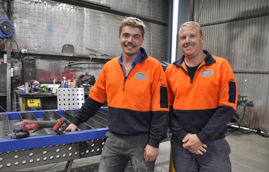 Former Moss Vale Tafe Metalwork Construction student, Joe Cramp with his boss, Michael White at Goulburn business, Fabworx Steel Supplies and Fabrication. Picture by Louise Thrower.