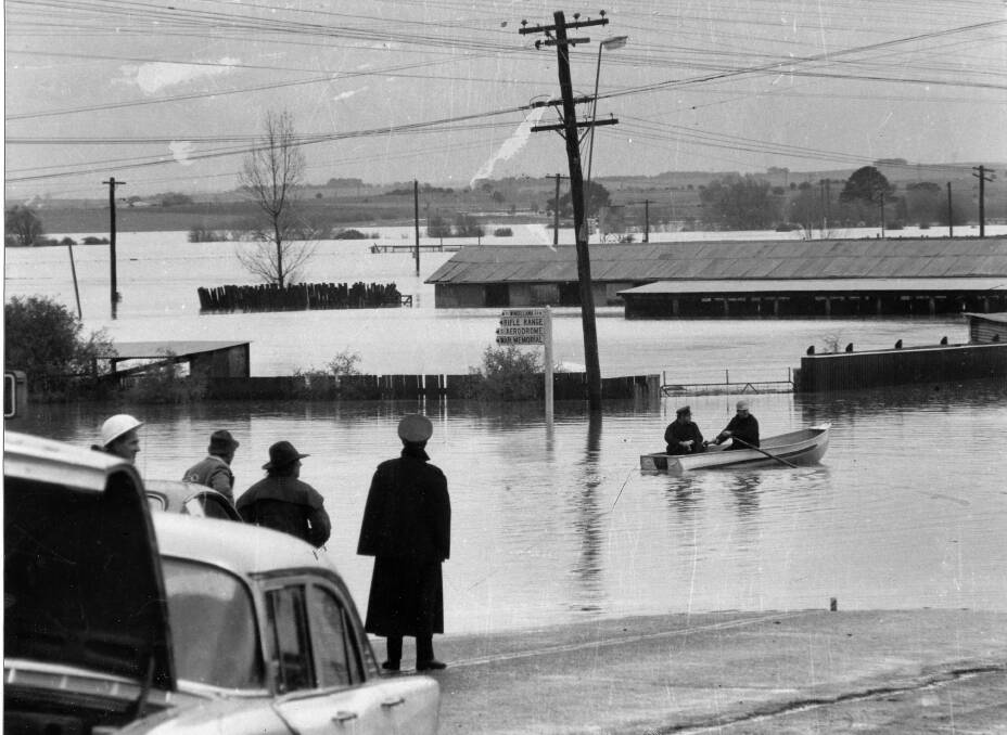 Leon Oberg covered copious floods in his 45 years including the biggest of them all, the 1974 event as pictured from Mundy St overbridge as a police boat begins a search for horses and their carers at the recreation area. 