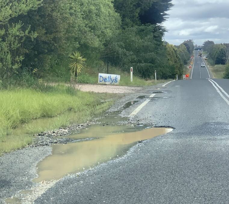 A pothole has again developed at 'Gordonvale,' about 25km north of Goulburn. The same pothole was filled earlier this year. Road crews can be seen in the distance repairing parts of the road. Picture supplied.