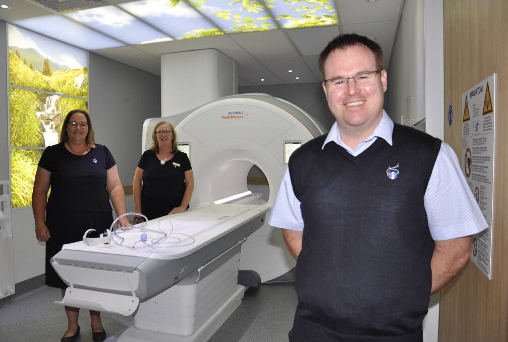 Canberra Imaging Group technician Ricky Daniher with office manager Clair Nolan and site manager, Therese Duncan with the new MRI machine. Picture by Louise Thrower. 