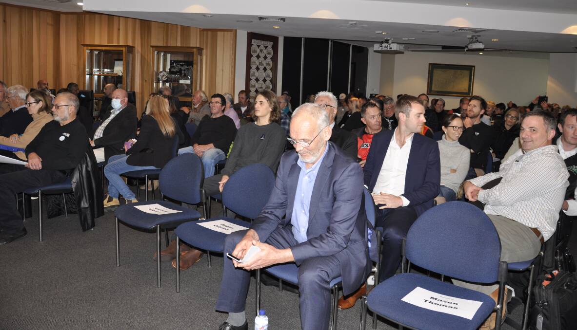 Resident Robert France (front) spoke during open forum at Tuesday night's meeting. Benalla Auto Group CEO Chris Lewis-Williams is sitting behind at right. The company owns Wakefield Park. Photo: Louise Thrower.