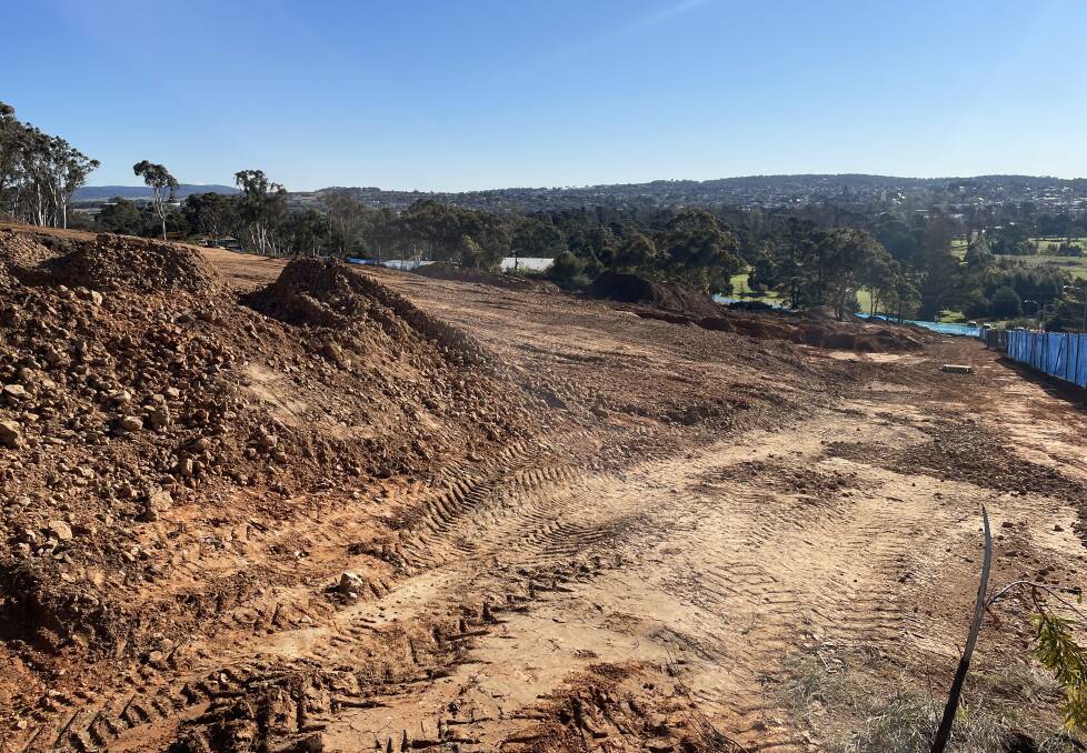 The land clearing at 99 May Street, as seen from the top of Chiswick Street, has left a visible scar below Rocky Hill. Photo: Louise Thrower.