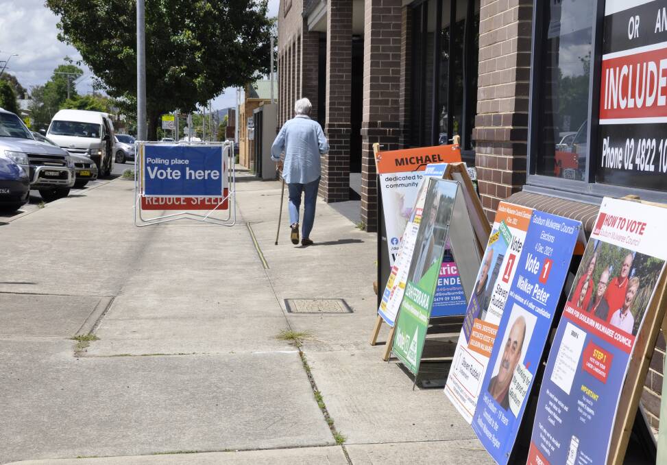 Candidates have left their sandwich boards outside the returning office in Bourke Street where pre-polling is underway. Candidates cannot hand out campaign material within 100 metres of a polling booth, due to COVID restrictions.