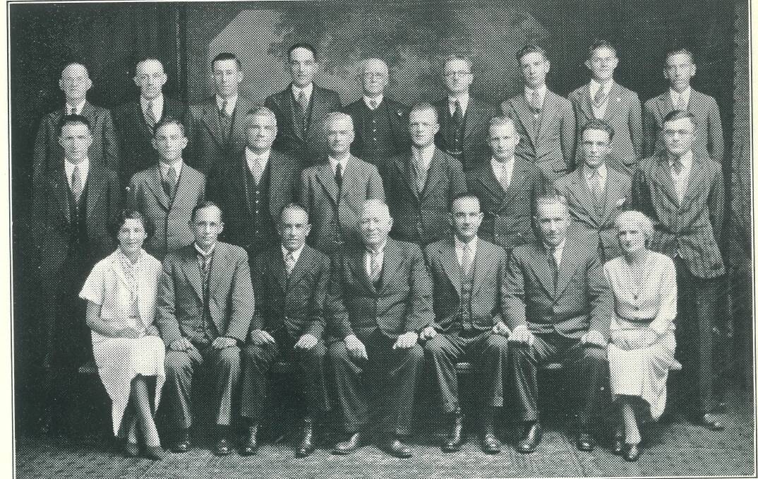 THE OFFICE: A 1935 staff photo taken by Watt Telfer shows editor Marmion Dart (second left, front row), next to office manager Jack Daniel and managing director, Tom Daniel (third right, front row). Photo: Goulburn Post archives.