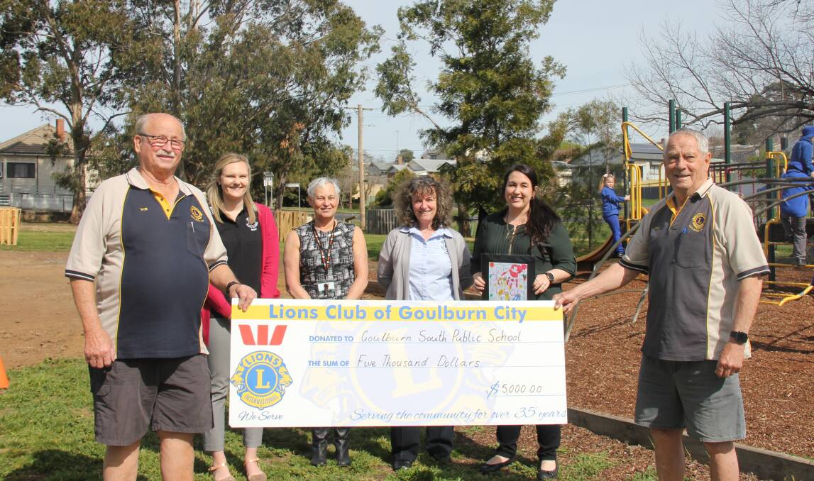 HANDY BOOST: Lions Club of Goulburn City members Bob Collins and Des Rowley presented a $5000 cheque to Goulburn South Public School's Friendship Park fundraising committee last September. Photo: Burney Wong.