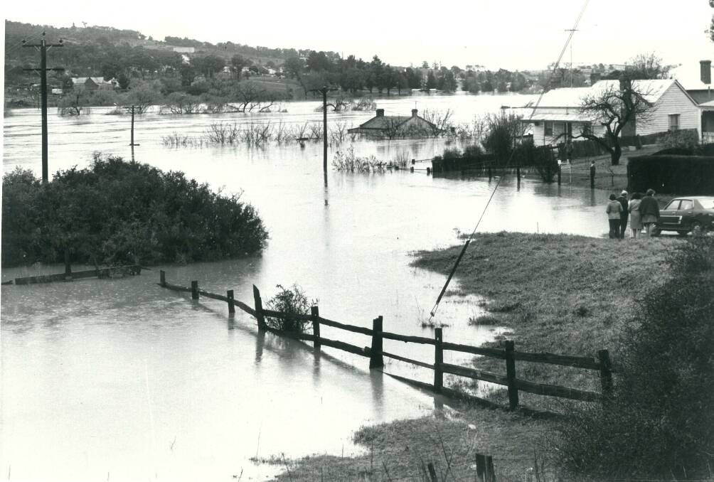 AWASH: Some houses in Lower Sterne Street, looking over Eastgrove, were almost under water during the 1974 flood in Goulburn. Photo: Goulburn Post archives.