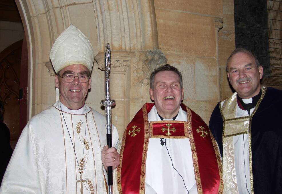 Bishop George Browning (left) and acting Dean, Dr Royce Thompson (right) at Dean Phillip Saunders' installation in July, 2004. Picture by Leon Oberg. 