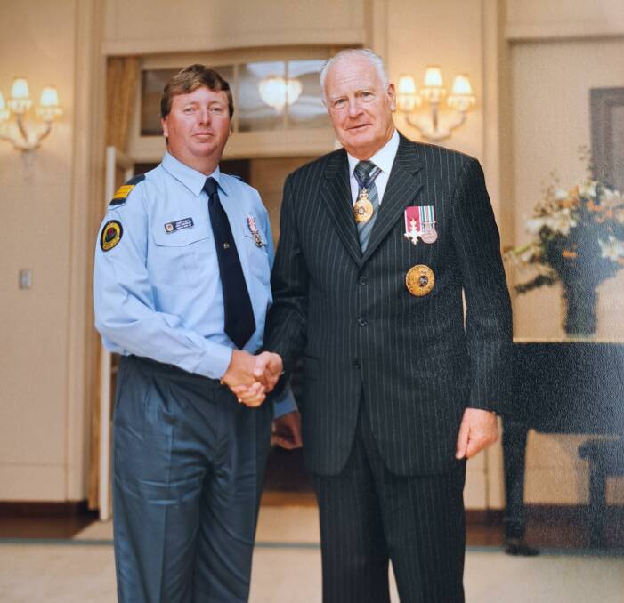 Gary Poile received the Australian Day Emergency Services Medal from the Governor General, Peter Hollingworth, AC OBE, in 2003 for his service to the SES. Picture supplied.