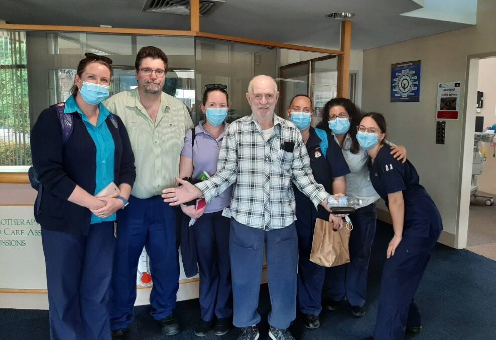 MILESTONE: Gunning man George (Peter) Solomons was the last patient to leave Bourke Street Health Service on Friday. He was surrounded by staff, including nurse unit manager Jenelle Crooks (second right). The event ended 105 years of in-patient care at the facility. Photo: Doloros Ryan.