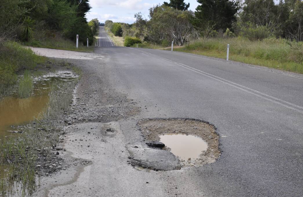 Rain has carved out a large pothole on the Taralga Road, some 25km for Goulburn outside the 'Gordonvale' homestead. Photo: Louise Thrower.