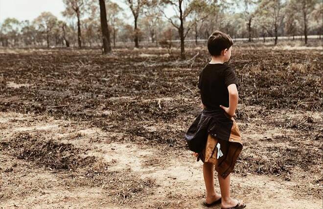 A young man ponders exactly what happened on the NSW Mid-North Coast just days ago. Photo: Jamie-lee Schmitzer