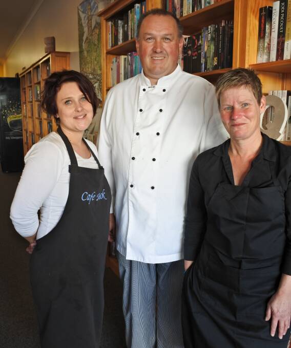 RESTORED: The Cafe Book team - Kristy Price, Peter Clark and Michelle Dimpel. The Cafe reopened on Monday after seven weeks of restoration work. A neighbouring fire caused extensive smoke damage to the business in June.