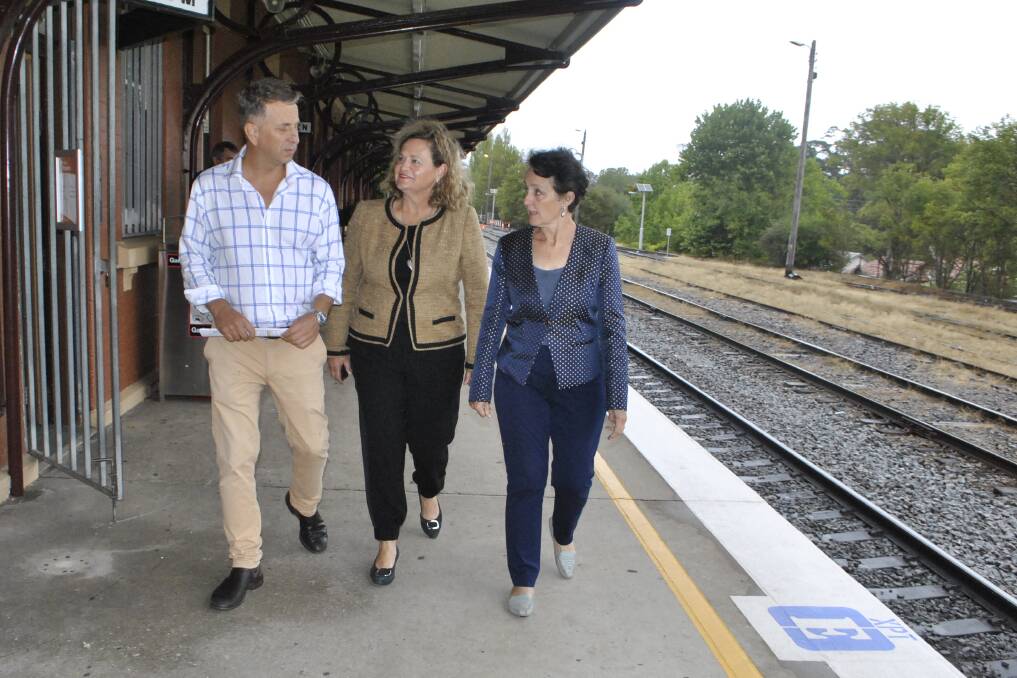 Minister for transport and infrastructure Andrew Constance, Liberal candidate for Goulburn Wendy Tuckerman and outgoing Goulburn MP Pru Goward at Moss Vale Train Station on Sunday.