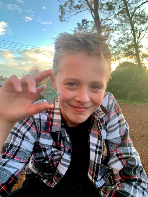 WHAT A FIND: Eleven-year-old Rory Gardiner discovered a British World War I service medal in his Robertson backyard on Saturday.