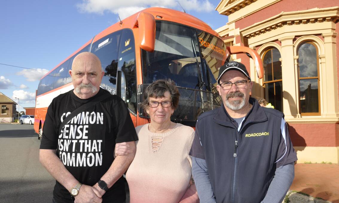 ON THE BUS: Lawrie and Colleen Sullivan with Trainlink bus driver Chris Janse. Photo Louise Thrower. 