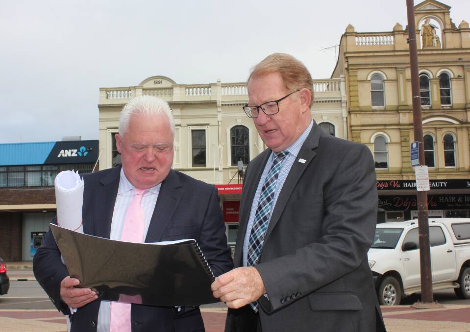 PLANS: Signature Care CEO Graeme Croft showing plans for the new aged care facility to Goulburn Mulwaree Mayor Bob Kirk. Photo David Cole 