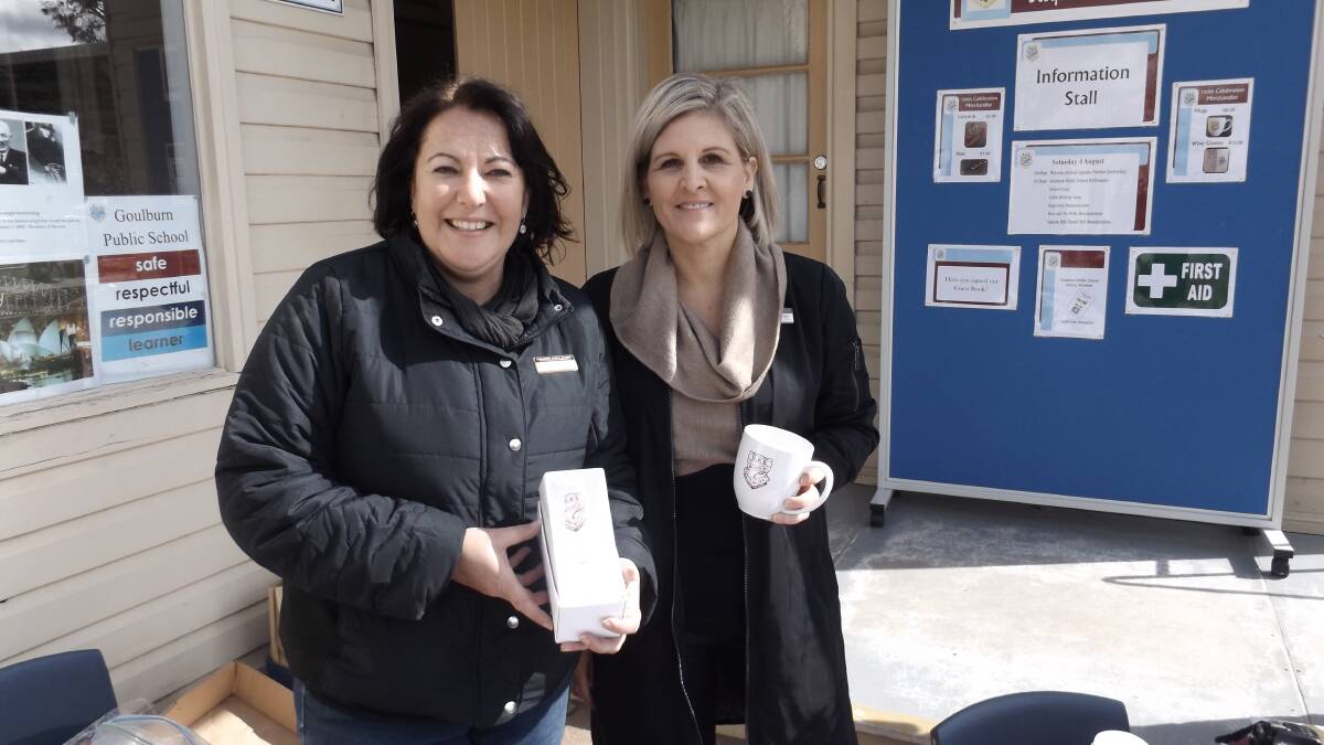The Bourke Street administration staff sold plenty of school merchandise such as pens and mugs and badges on the day. Katie Latham and Julie Baragry. 