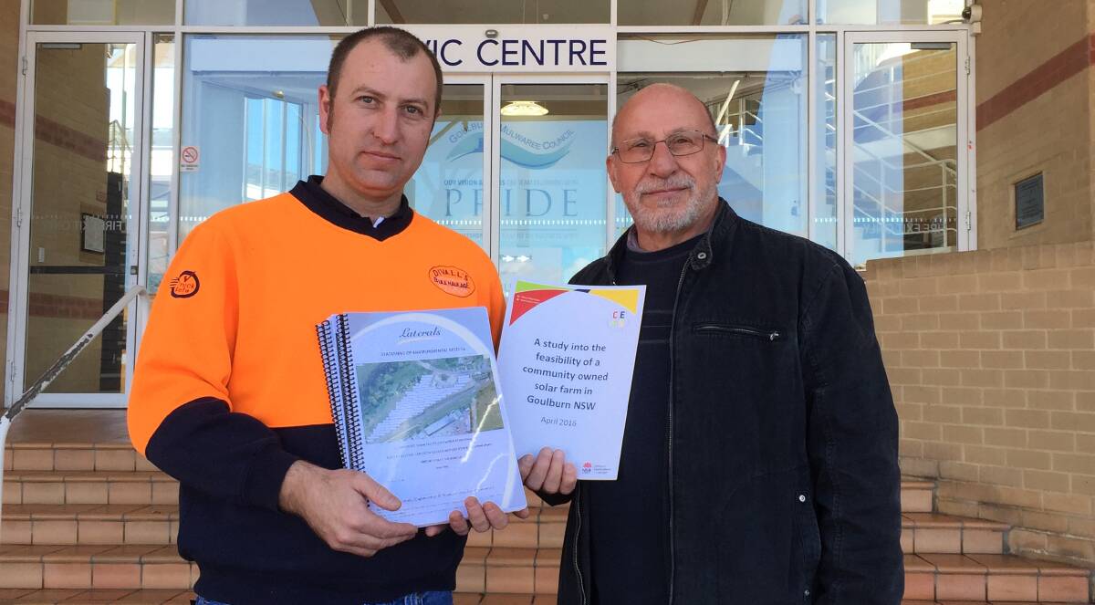 APPPROVED: Community Energy For Goulburn's Caleb Fisher and Nestor Ellinopoullos with the Goulburn Solar Farm DA when they lodged it with the council last year. 