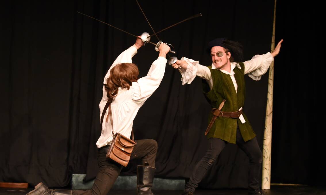 SWORD FIGHTING: Harrison Treble and Blake Selmes is a scene from The Three Musketeers, now on at the Lieder Theatre. Photos Danny Scott. 