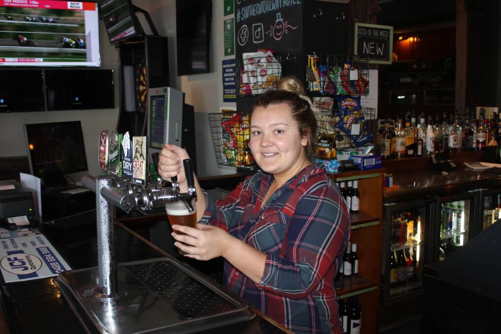 BEST DRAUGHT BEER?: Barmaid Laura Edwards pouring one of the beers at the Southern Railway Hotel. The hotel is up for a Best Draught Beer award in the Australian Hotel Association Awards on November 21. 