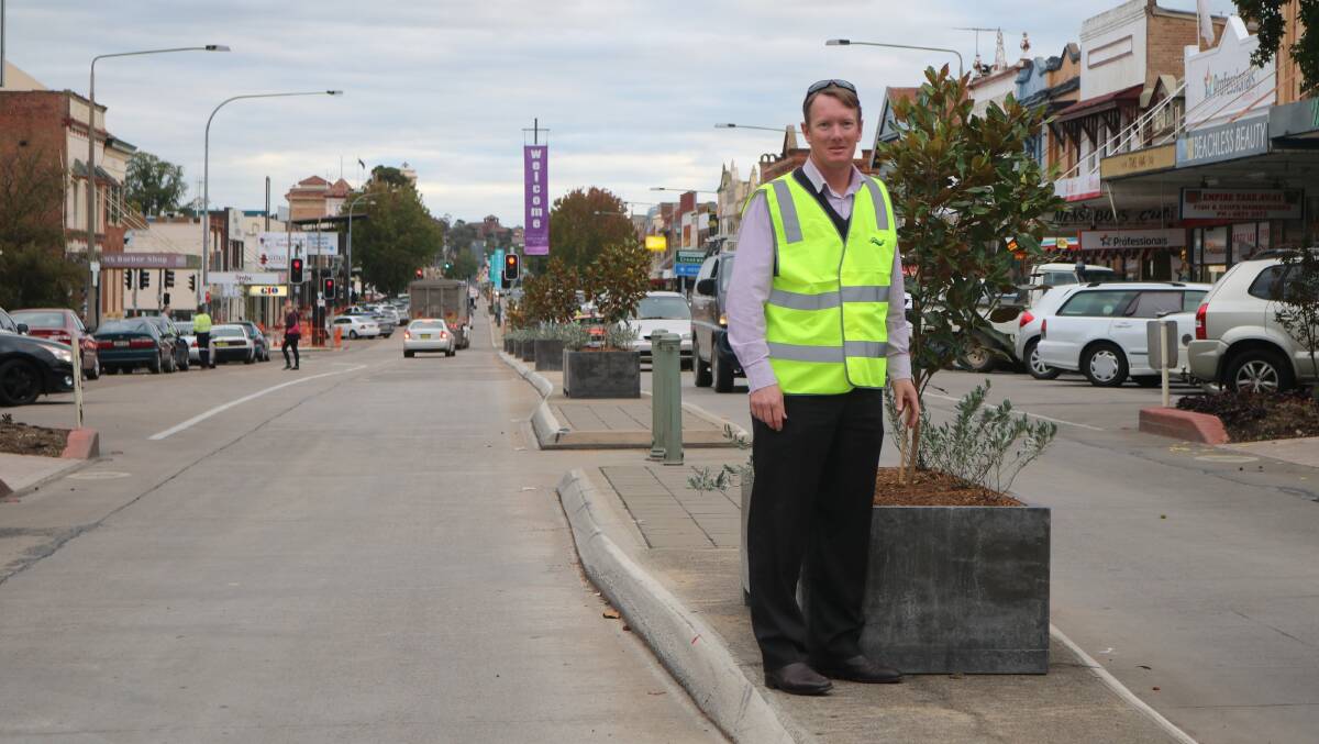 MAGNOLIA TREES: Goulburn's main street will be blooming in spring and summer thanks to new Magnolia trees that council's business manager of community facilities Rob Hughes is pictured with. 
