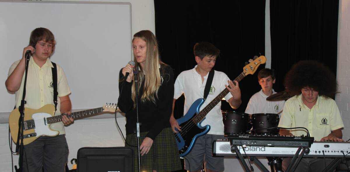 REHEARSAL: The band called Small Town Afro rehearsing at Mulwaree High School yesterday. (Left) Nathan Tunstall (guitar), Micah Absolum (vocals), Harry Russell (bass), Bryn Wood (drums) and Michael Dunne (keyboard). Photo David Cole. 