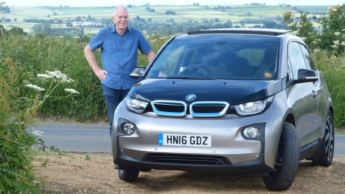 Speaker Tom Hunt with his hybrid vehicle. Photo supplied. 