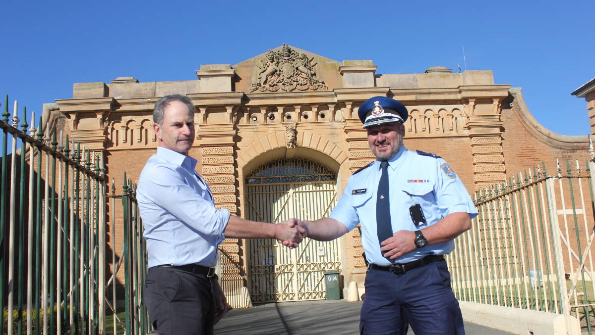 WELCOME: One of the longest serving staff members at Goulburn Jail Shane McColl greets new Governor Wayne Taylor. Photo David Cole.