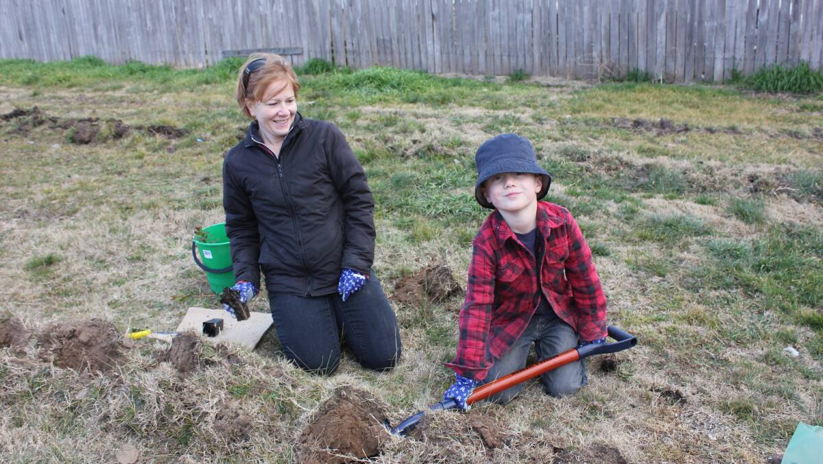 Alison and Billy Holmes got their hands dirty at last year's National Tree Planting Day in Goulburn. Photo David Cole. 