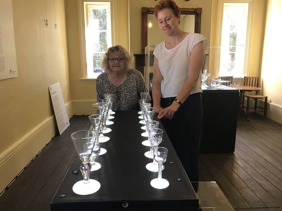 RARE GLASS: Riversdale manager Christine Bryan and National Trust representative Claire Baddeley with the Georgian glass at Riversdale, on exhibition until April 28. Photo: David Cole