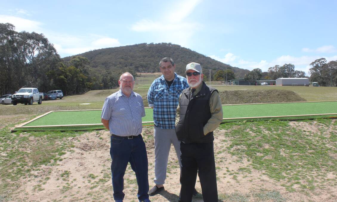 IT IS IMPOSSIBLE: SSAA president Bill Irvine, Goulburn Rifle Club president Tony Weston and former SSAA president Ken Kenchington at the Goulburn Rifle Range on Tuesday. The large hill that separates the Rifle Range and the Waste Transfer Station is in the background. The shooters say it is impossible to hit the Waste Transfer (behind the large hill) Station from the Rifle Range. 