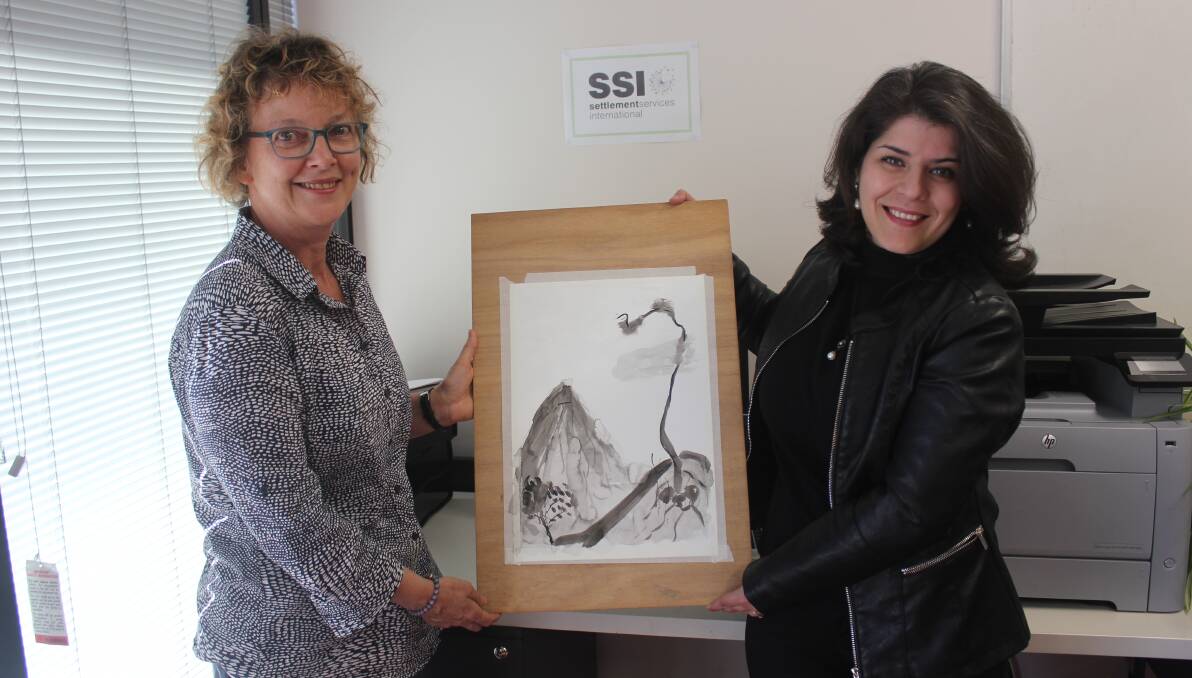 ART WORKSHOP: Barbara Nell and Seta Nooraninejad with an artwork created by Sylvia Brook in a recent workshop. Another art workshop is being held soon.
