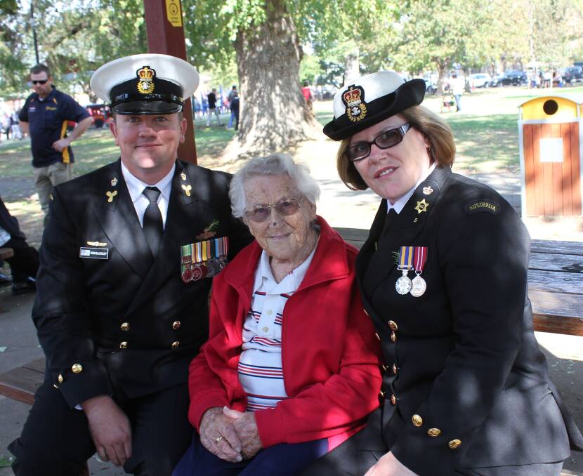 Pauline McCarthy with her daughter Chief Petty Officer Noelene Brennan and grandson Chief Petty Officer Don Blackley in Belmore park on Anzac Day. 