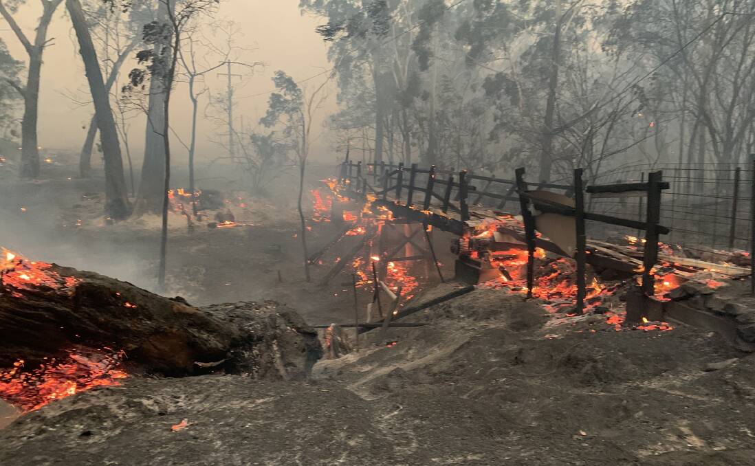 FOOTBRIDGE: This pic taken by the Carwoola RFS shows the old wooden footbridge just before the village of Nerriga. It has been lost in the fires. 