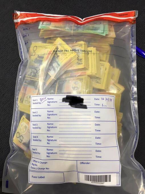Cash allegedly seized from a vehicle after it was searched in Goulburn.