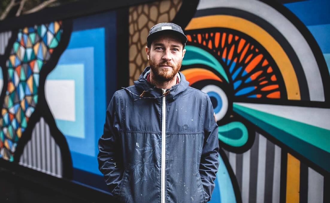 COLOURFUL: Bradley Eastman with some of his work. He will be using his skills to add more life to Russell Lane. Photo by Billy Zammit. 