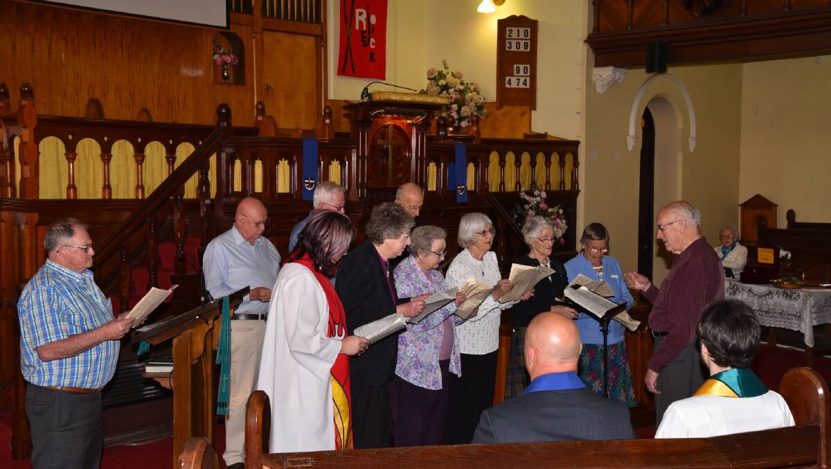 CHOIR: The choir singing at the service of celebration in the Uniting Church last Sunday. Photo Jim Webb. 