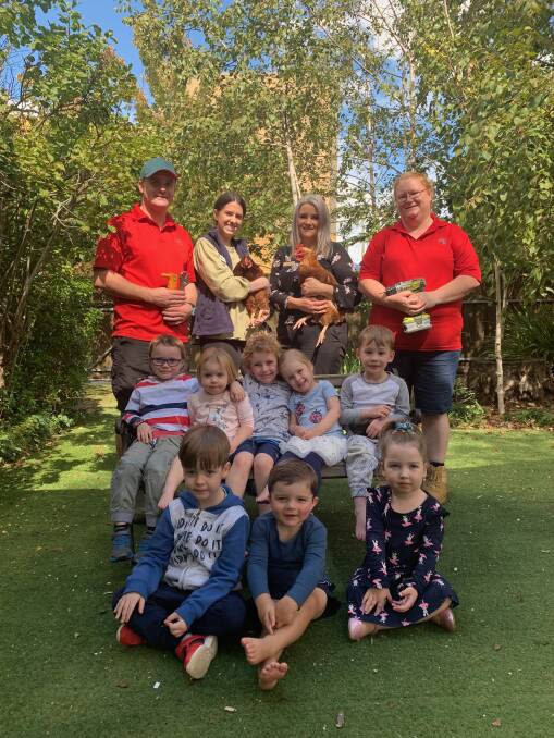 (Left, back) Bunnings employee Jono Allanson, Olivia Brimmer, Anna Lamarra, Bonnie Wilson. (Middle) Will, Andie, Avery, Rory, Campbell. (Front) Alex, Harry and Evie. 